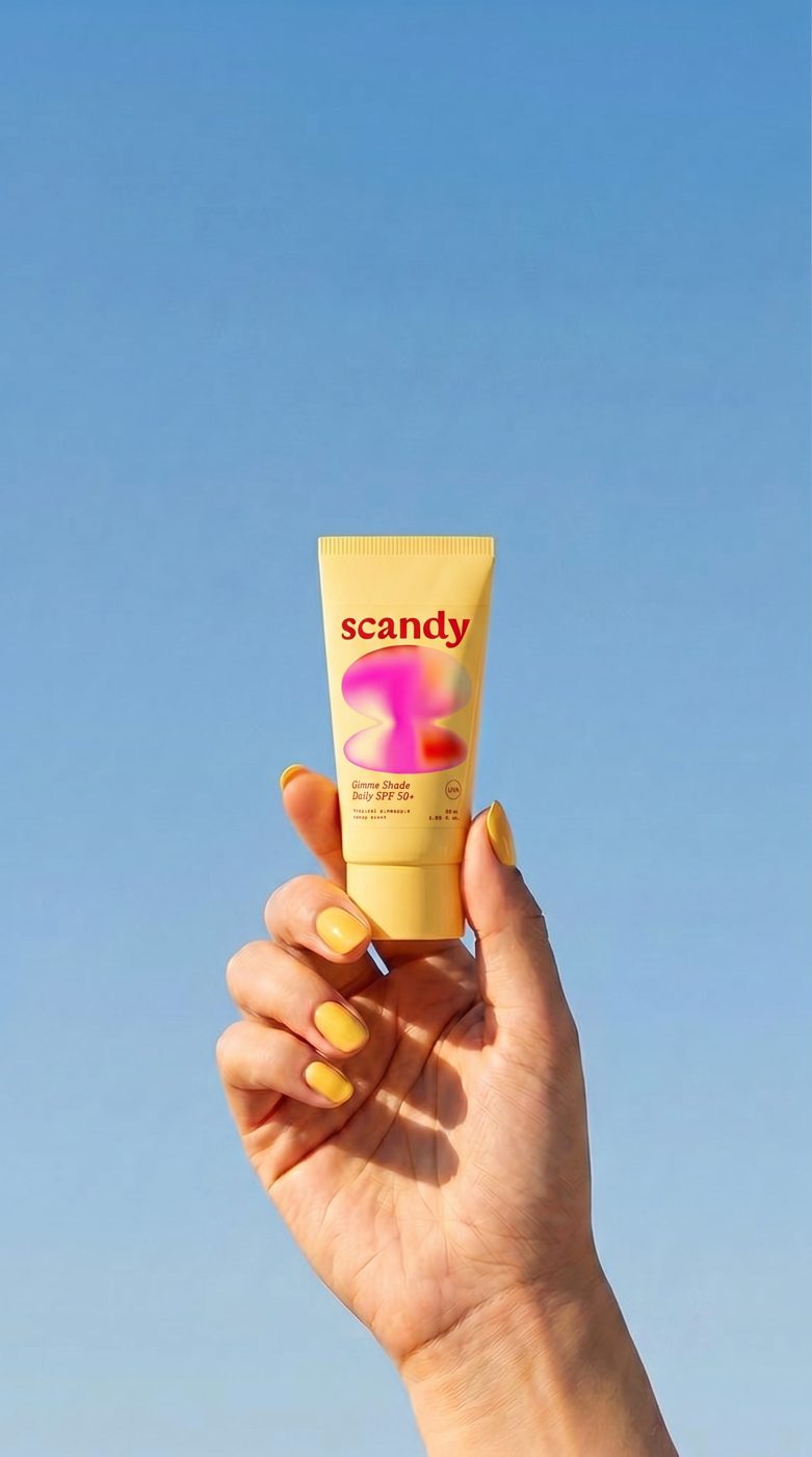 Scandy SPF held up to a blue sky